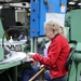 Lake City Army Ammunition Plant employee does a quality inspection on ammunition.