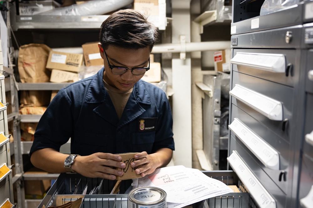 Sailor Stows Parts Aboard USS Curtis Wilbur (DDG 54)