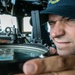 USS Mitscher (DDG 57) junior officer looks through navigational alidade