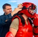 OS1 Casey Leverett and OS2 Kurt Goldsmith prepare for Non-Lethal Weapons training