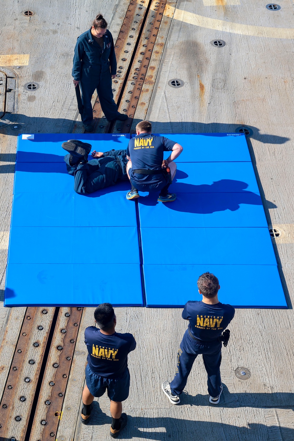 Sailor demonstrates an effective defensive take-down maneuver
