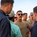 USAF and partner nation service members participate in a joint fire vehicle inspection