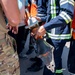 USAF and partner nation service members participate in a joint fire vehicle inspection