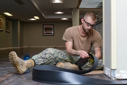 NMCB 11 Seabees refloor Pascagoula Barracks