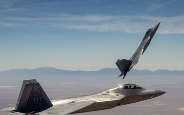 Edwards F-22 Raptors execute lead change over the Mojave Desert
