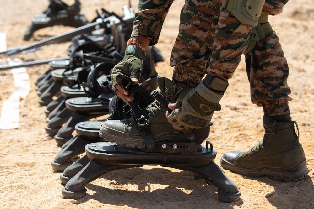 Indians demonstrate their explosive hazard detection equipment to U.S. Marines and multi-national partners