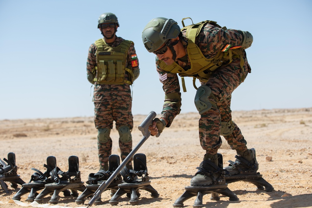 Indians demonstrate their explosive hazard detection equipment to U.S. Marines and multi-national partners