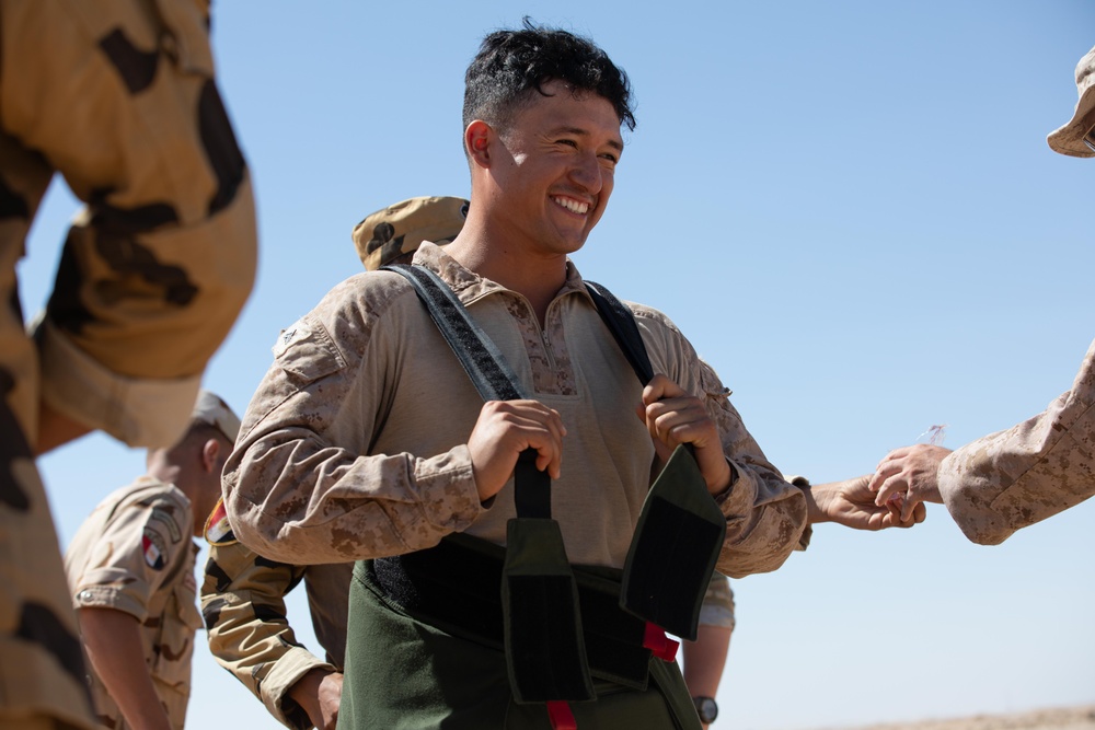 Indians demonstrate their explosive hazard detection equipment to U.S. Marines and multi-national partners