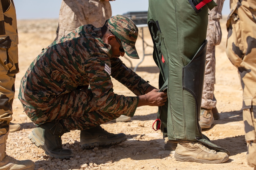 Indians demonstrate their explosive hazard detection equipment to U.S. Marines and multi-national partners
