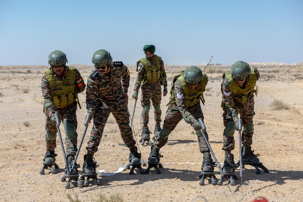 Indians demonstrate their explosive hazard detection equipment to U.S. Marines and multi-national partners