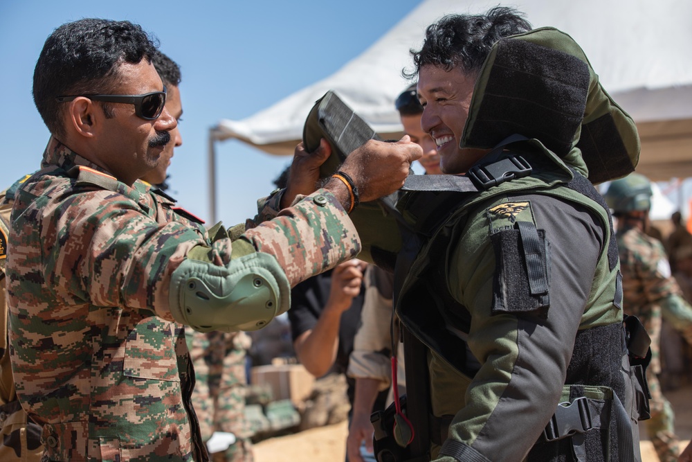 Indians demonstrate their explosive hazard detection equipment to U.S. Marines and multi-national partners