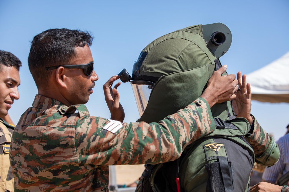 Indians demonstrate their explosive hazard detection equipment to U.S. Marines and multi-national partners