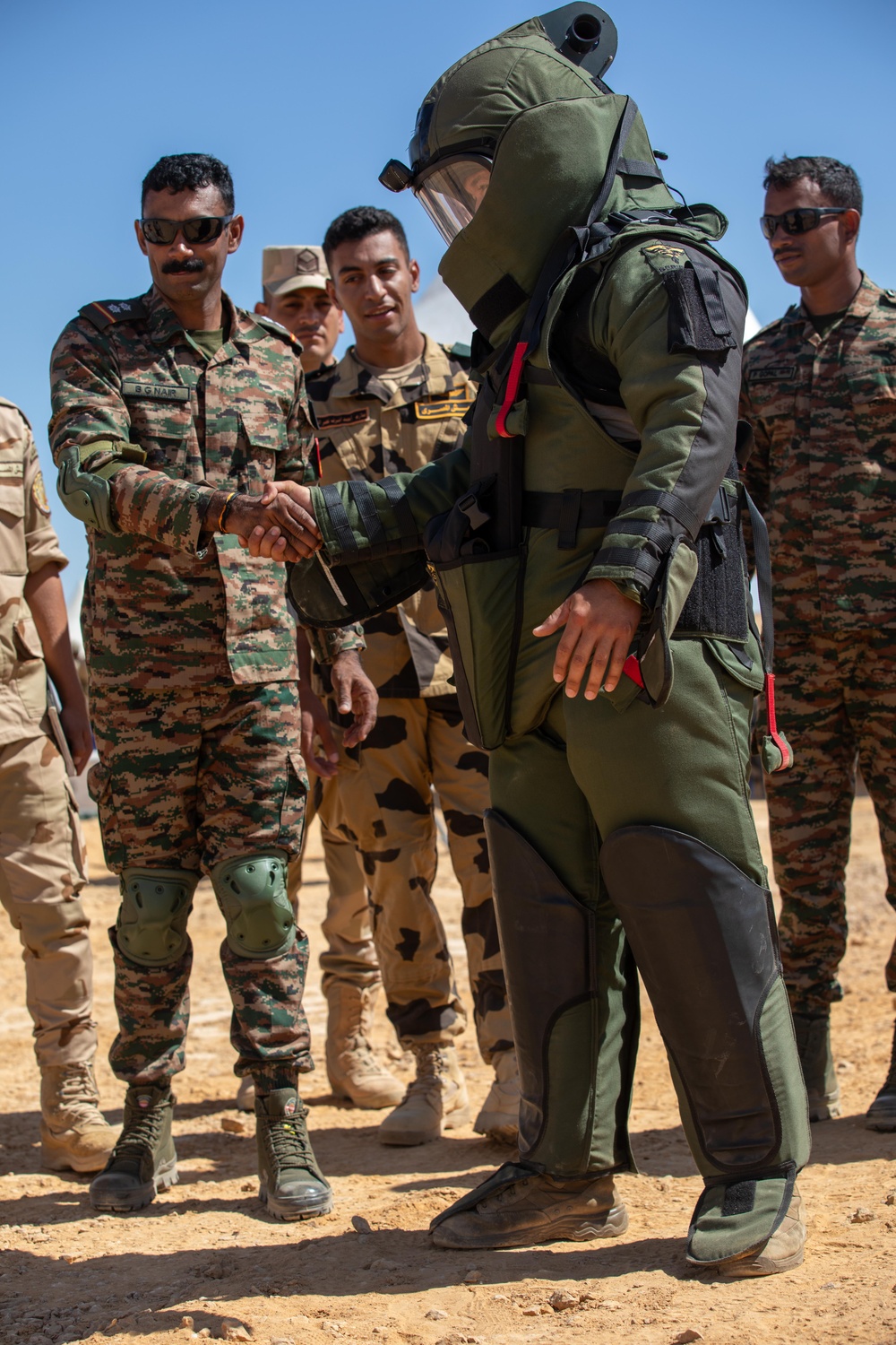 Indians demonstrate their explosive hazard detection equipment to U.S. Marines and multi-national partners