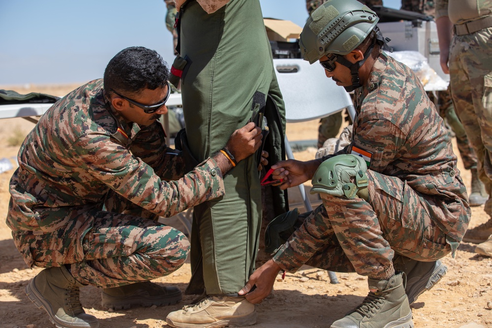 Indians demonstrate their explosive hazard detection equipment to U.S. Marines and multi-national partners