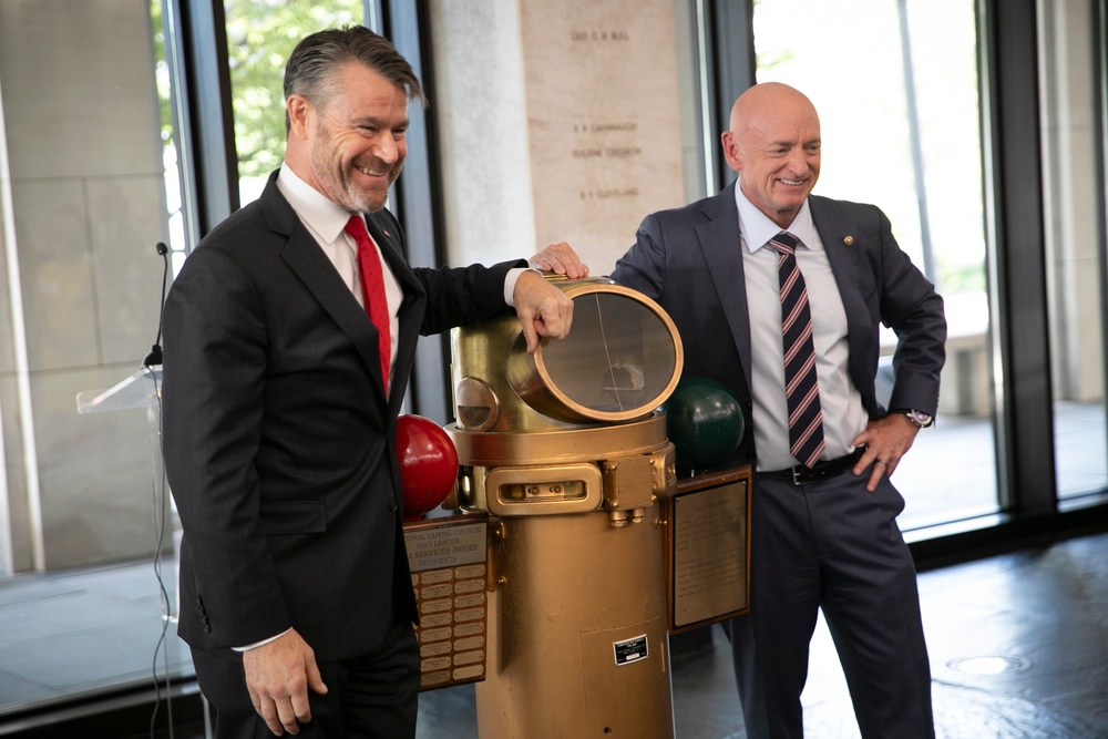 Senators Accept Navy League Sea Services Award