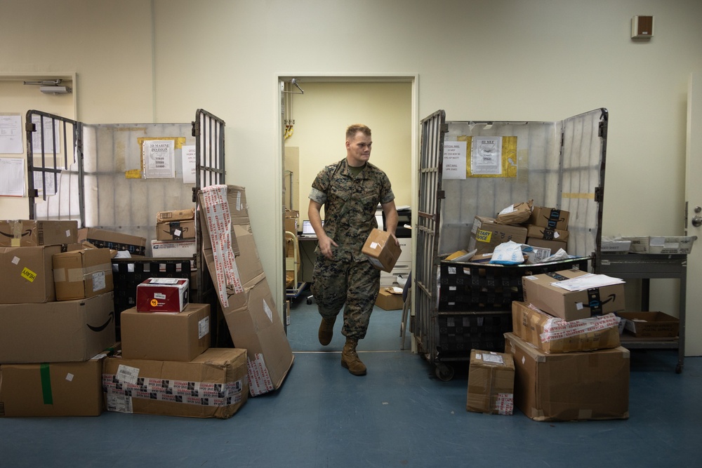 Camp Courtney Postal Clerks Sort Through Mail Delivery