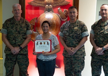OKINAWA, JAPAN – U.S. Navy Spouse of 30 years receives appreciation award