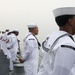 Sailors aboard the USS John Finn man the rails during a sea and anchor detail in Jakarta, Indonesia