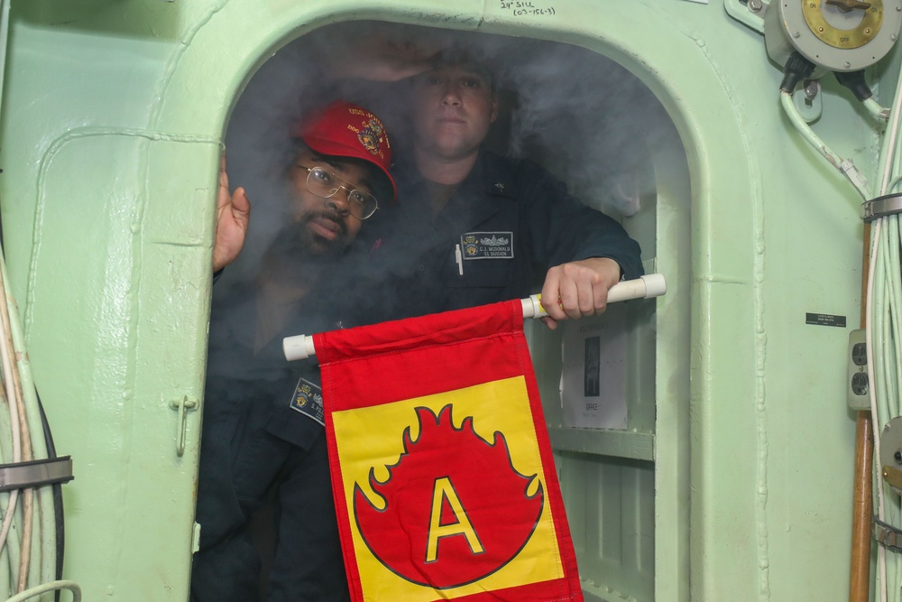 Sailors aboard the USS John Finn conduct a general quarters drill in the Java Sea during Super Garuda Shield
