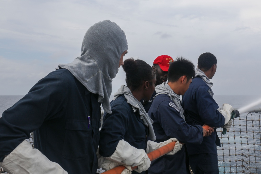 Sailors aboard the USS John Finn conduct a general quarters drill in the Java Sea during Super Garuda Shield