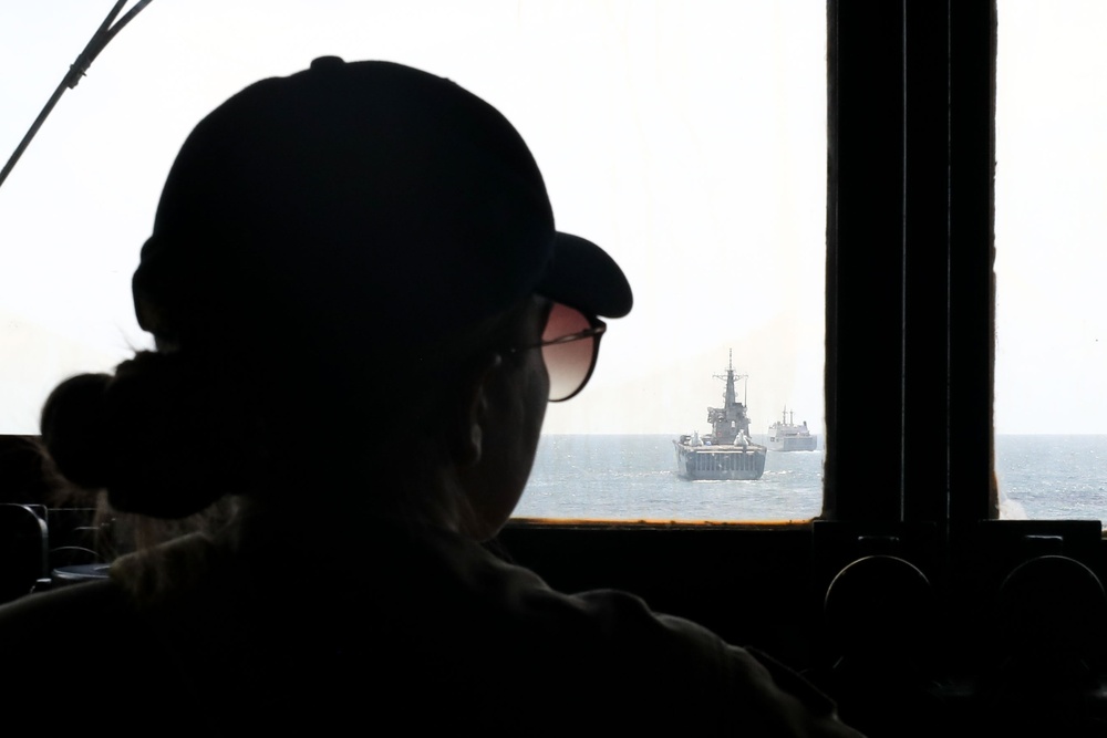 The USS John Finn sails in formation with KRI John Lie, KRI Makassar, and JS Osumi during Super Garuda Shield in the Java Sea