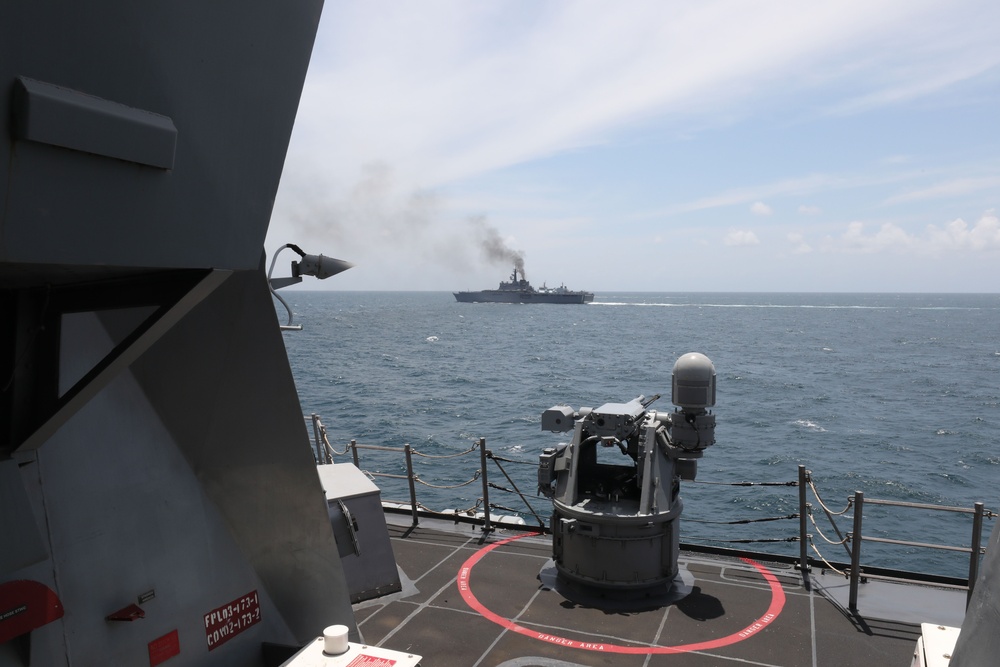 The USS John Finn sails in formation with KRI John Lie, KRI Makassar, and JS Osumi during Super Garuda Shield in the Java Sea