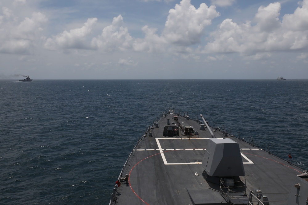 The USS John Finn sails in formation with KRI John Lie, KRI Makassar, and JS Osumi during Super Garuda Shield in the Java Sea