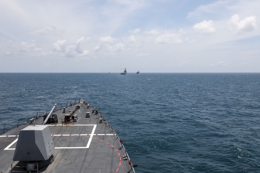 The USS John Finn sails in formation with KRI John Lie, KRI Makassar, and JS Osumi during Super Garuda Shield in the Java Sea