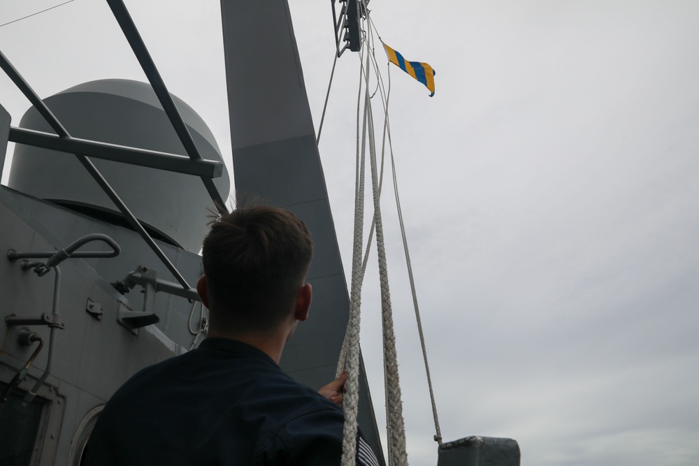 Sailors aboard the USS John Finn conduct a visual communication exercise during Super Garuda Shield in the Java Sea
