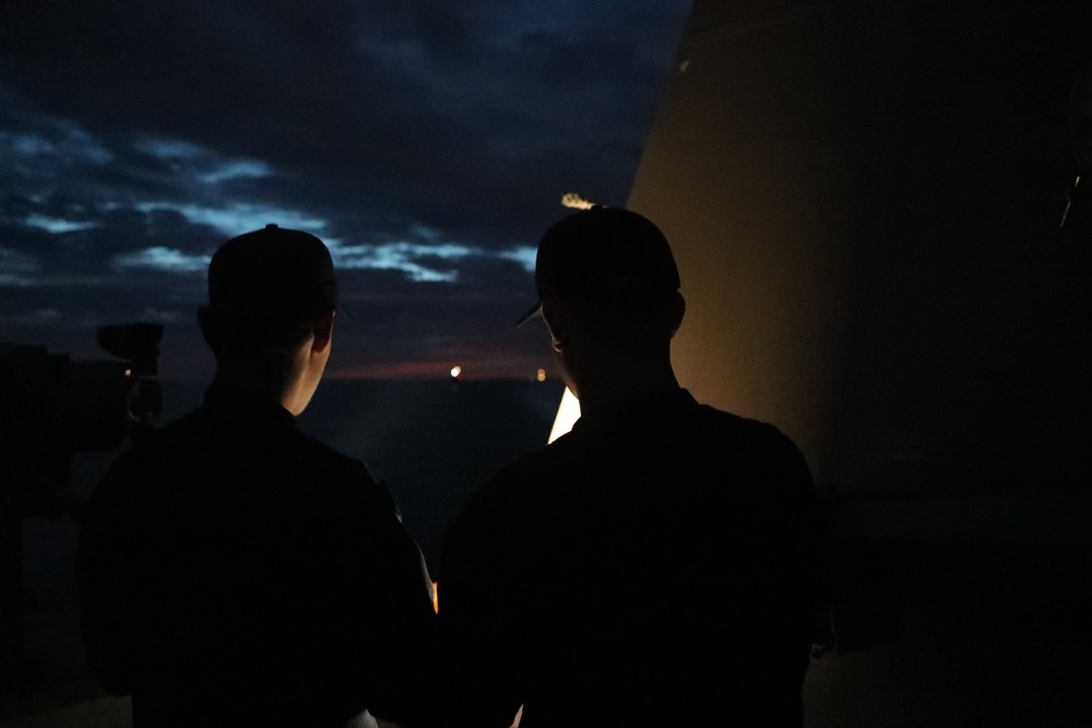 Sailors aboard the USS John Finn conduct a visual communication exercise during Super Garuda Shield in the Java Sea