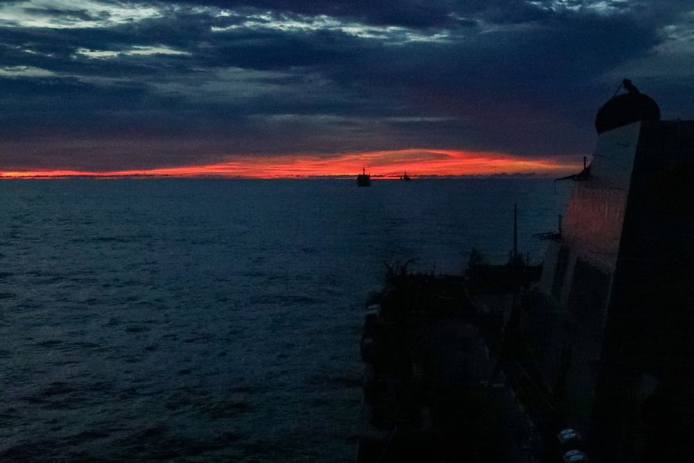 Sailors aboard the USS John Finn conduct a visual communication exercise during Super Garuda Shield in the Java Sea