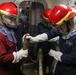 Sailors aboard the USS John Finn conduct a damage control exercise in the Java Sea