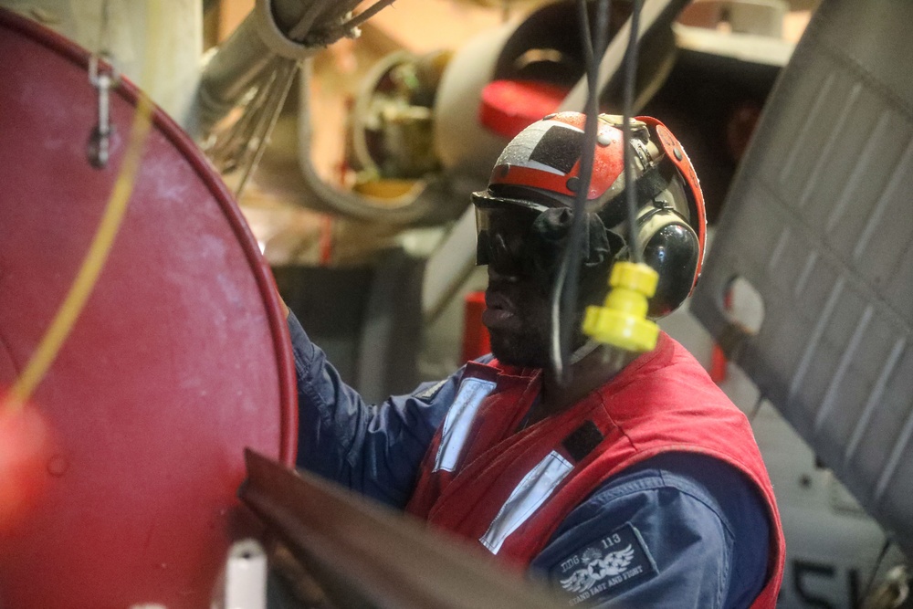 Sailors aboard the USS John Finn conduct a crash and salvage drill in the Java Sea
