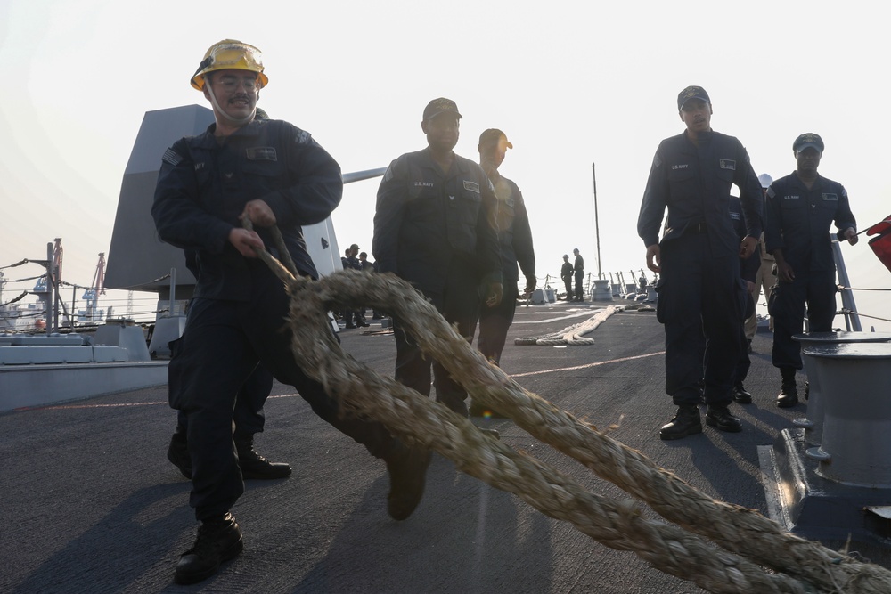 Sailors aboard the USS John Finn conduct a sea and anchor detail in Jakarta, Indonesia