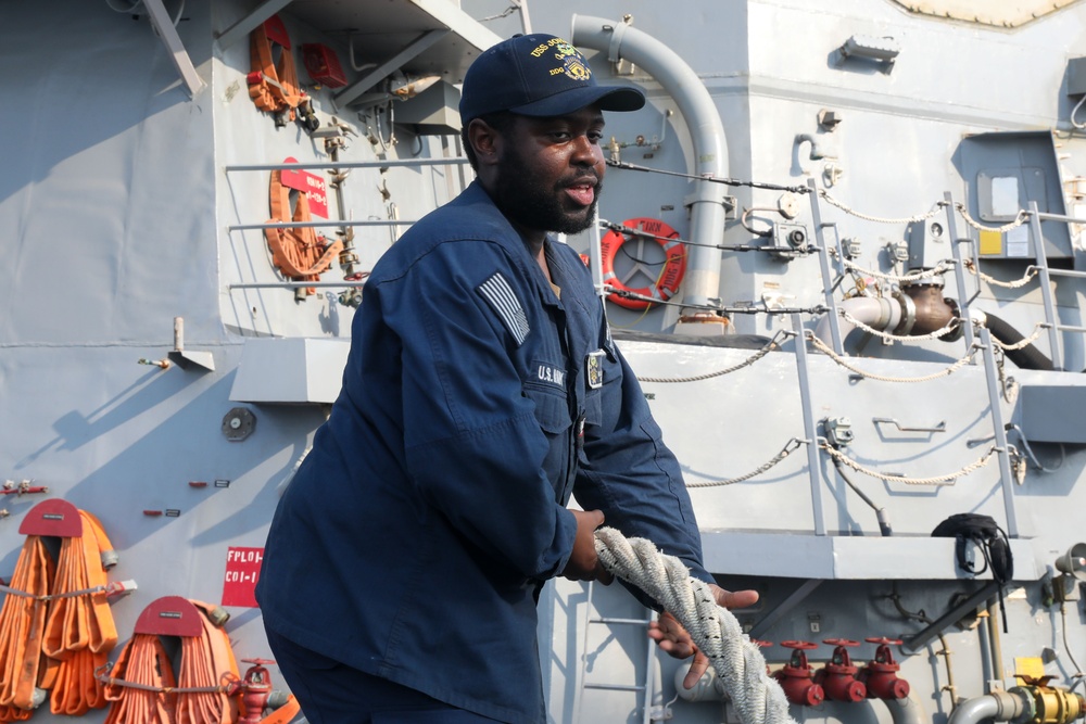 Sailors aboard the USS John Finn conduct a sea and anchor detail in Jakarta, Indonesia