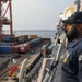 Sailors aboard the USS John Finn conduct a sea and anchor detail in Jakarta, Indonesia
