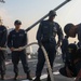 Sailors aboard the USS John Finn conduct a sea and anchor detail in Jakarta, Indonesia