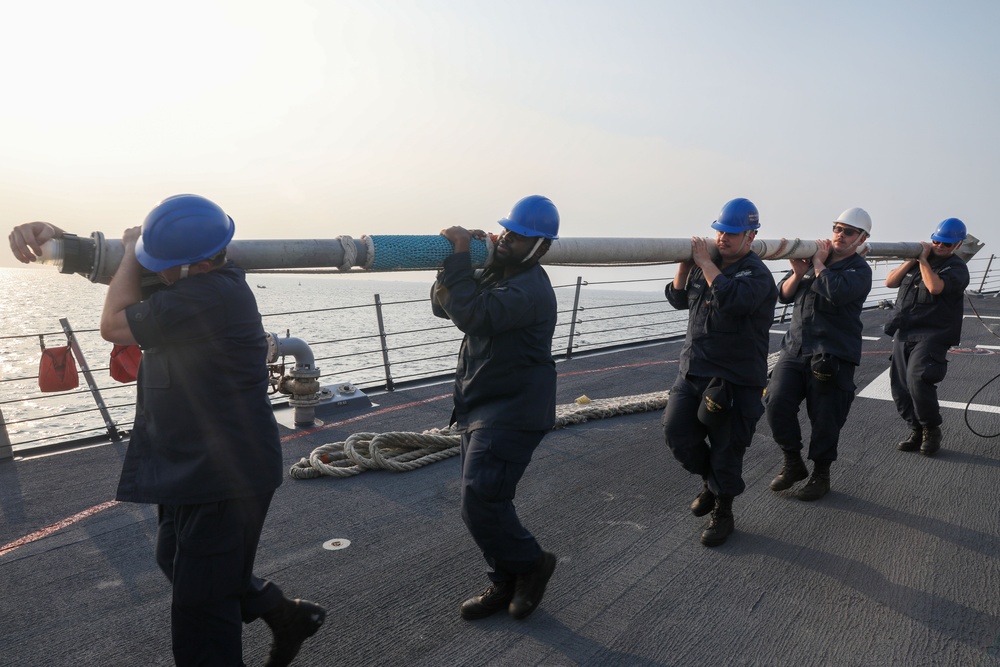 Sailors aboard the USS John Finn conduct a sea and anchor detail in Jakarta, Indonesia