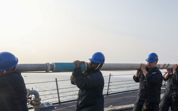 Sailors aboard the USS John Finn conduct a sea and anchor detail in Jakarta, Indonesia