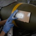 Munitions Airmen build bombs during combat deployment