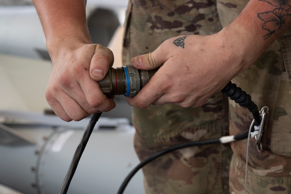 Munitions Airmen build bombs during combat deployment