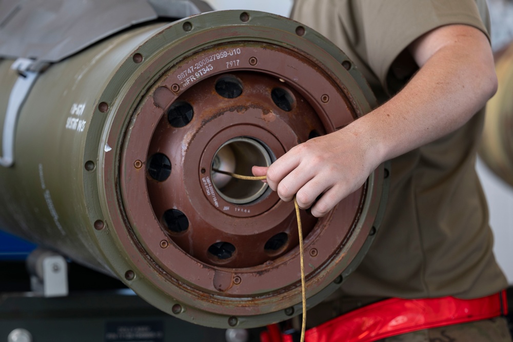 Munitions Airmen build bombs during combat deployment