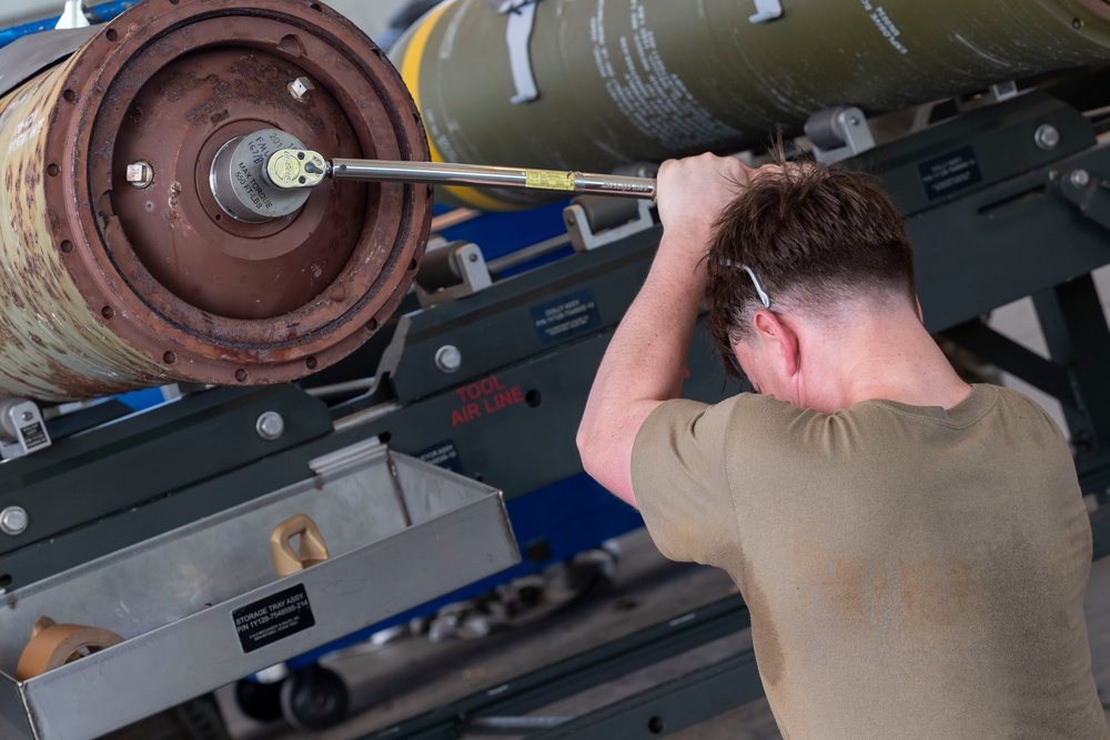 Munitions Airmen build bombs during combat deployment