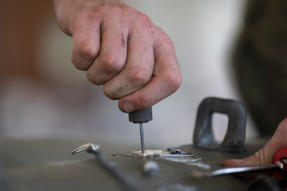 Munitions Airmen build bombs during combat deployment