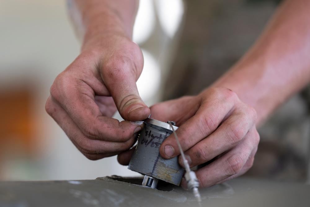 Munitions Airmen build bombs during combat deployment