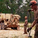 U.S. Army Soldiers pull cable while rigging an overturned vehicle during the Wheeled Vehicle Recovery Operations Course held at the 139th Regional Training Institute in Fort Bragg, NC, August 8, 2025