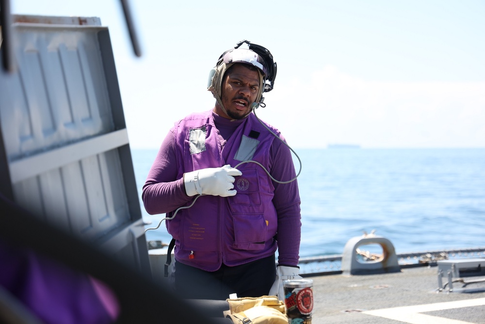 GSM2 Antoine Hicks Man Communications During Helicopter Refueling Operations