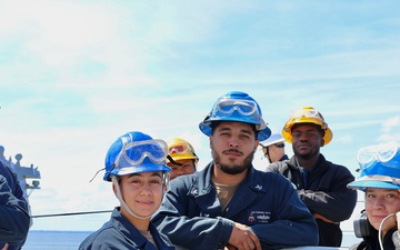 Boatswains Mates Onboard USS FARRAGUT Pose in Front of the Anchor Handbrake