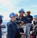 Boatswains Mates Onboard USS FARRAGUT Pose in Front of the Anchor Handbrake