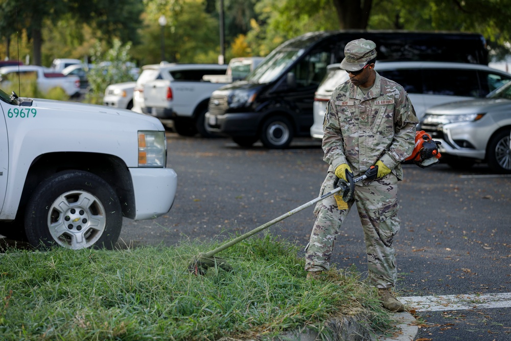 Guardsman with the D.C. National Guard perform landscaping and trash cleanup at East Potomac Park